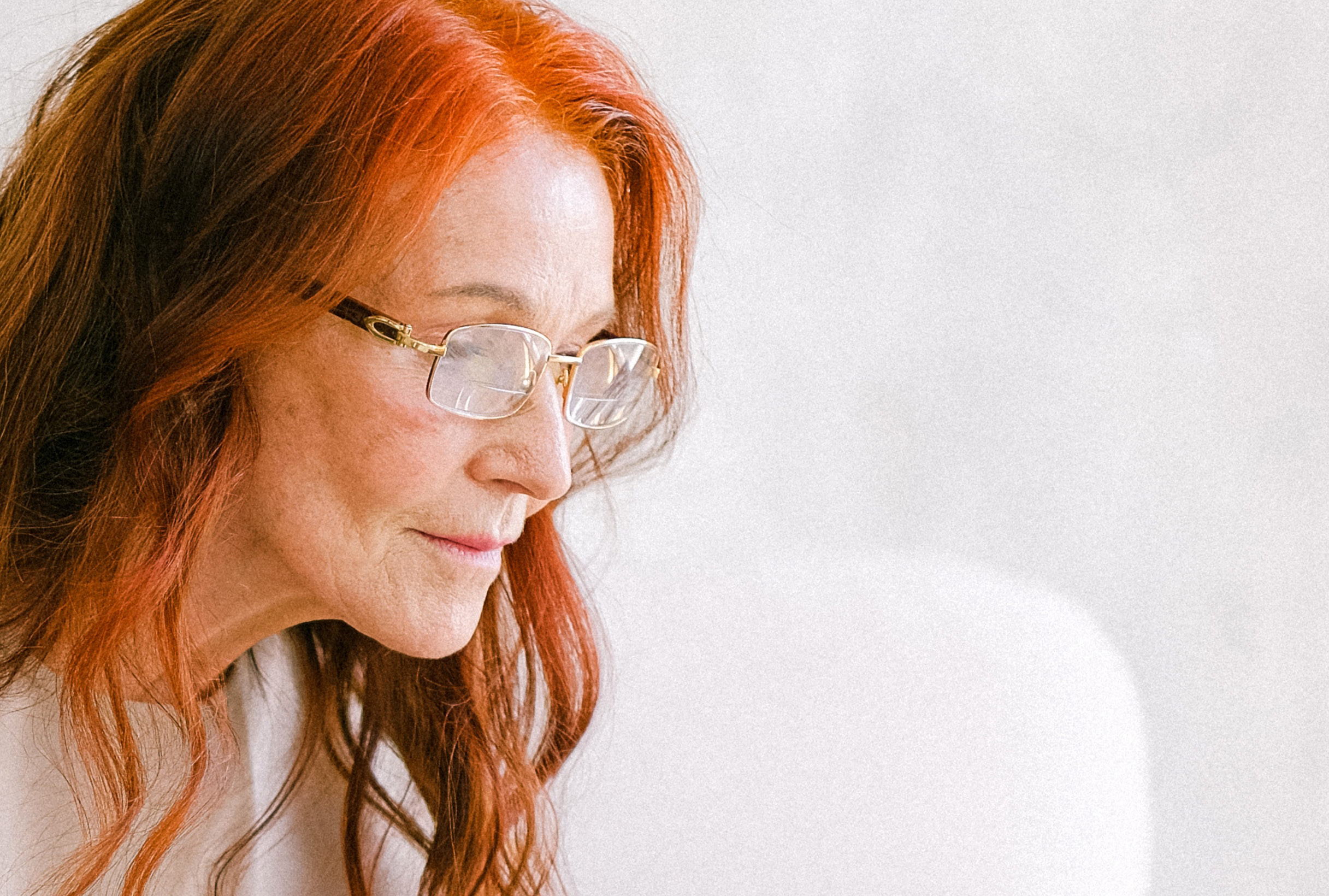 Older woman with glasses on.